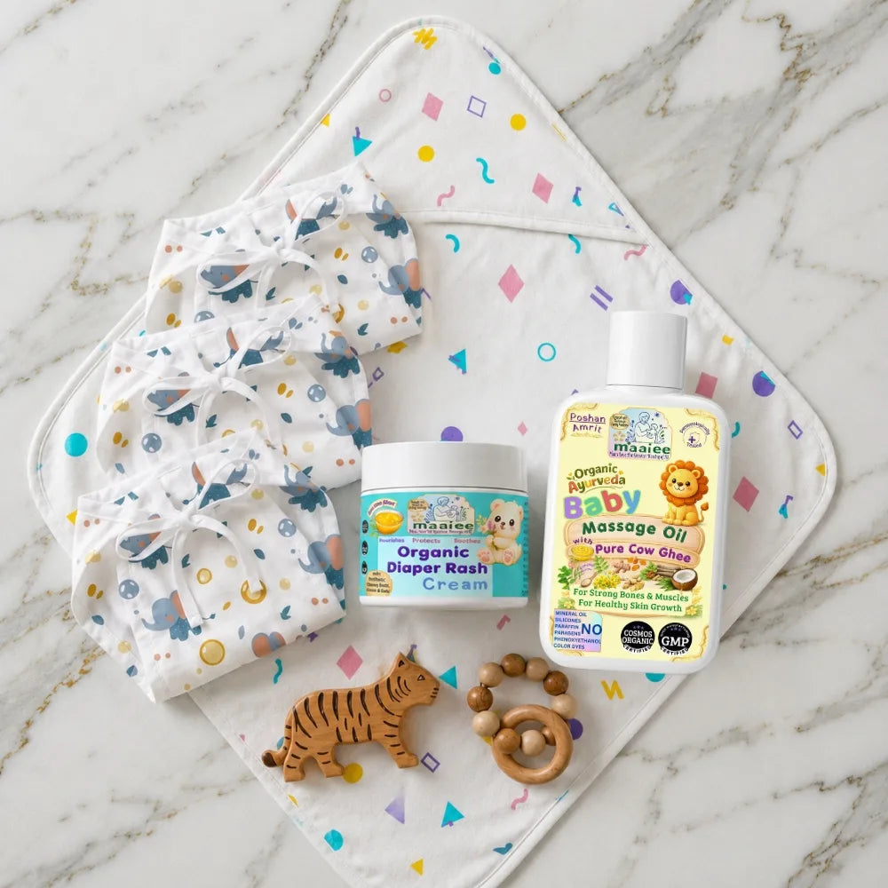 Maaiee Ayurvedic newborn care set with cow ghee massage oil, diaper cream, hooded towel and nappy