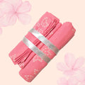 Maaiee mulmul swaddle with four soft washcloths in a gentle pink pattern