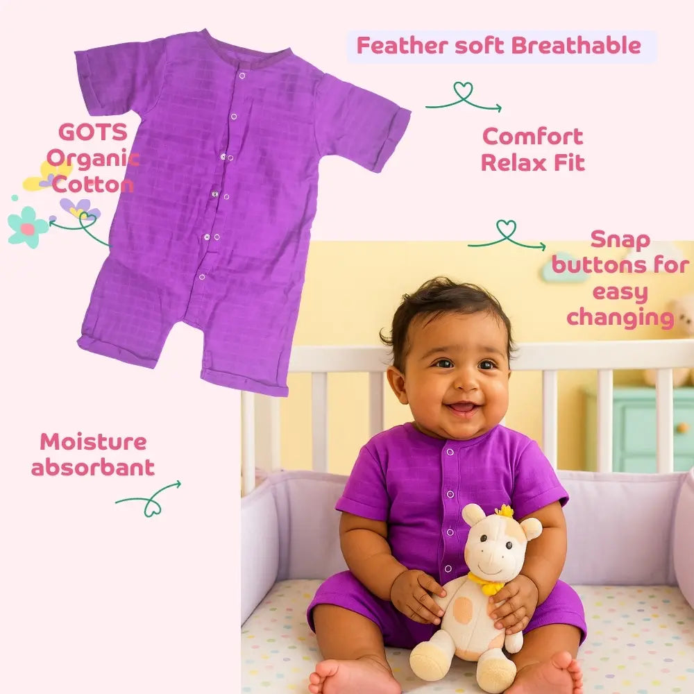 Smiling baby wearing a Maaiee organic cotton purple romper with soft breathable fabric features.