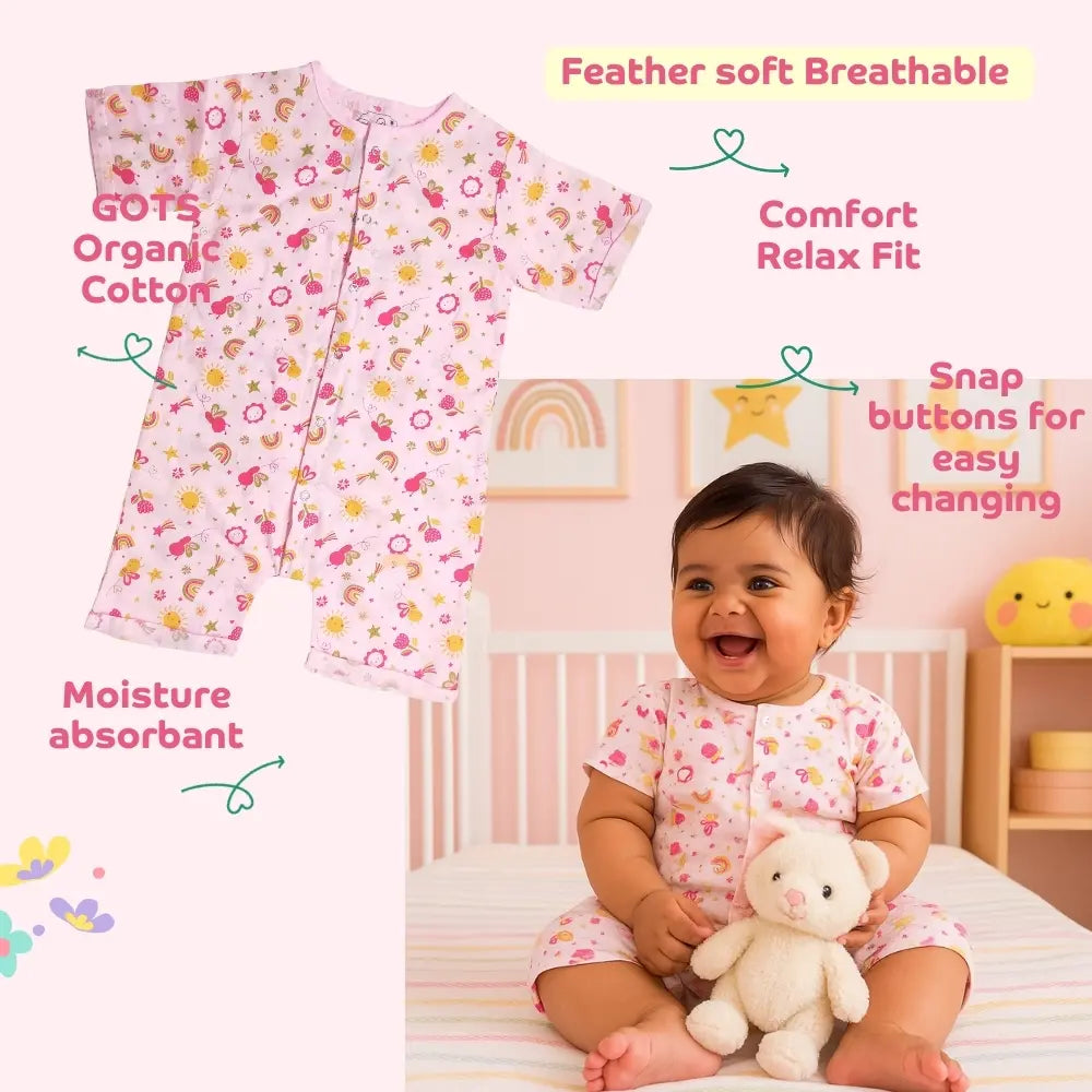 Smiling baby wearing a Maaiee organic cotton romper rosebud with soft breathable fabric features.